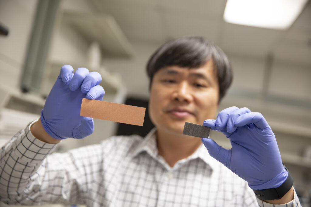 Wonmo Kang holding copper (on the left) and graphene (on the right). Photographer: Erika Gronek/ASU