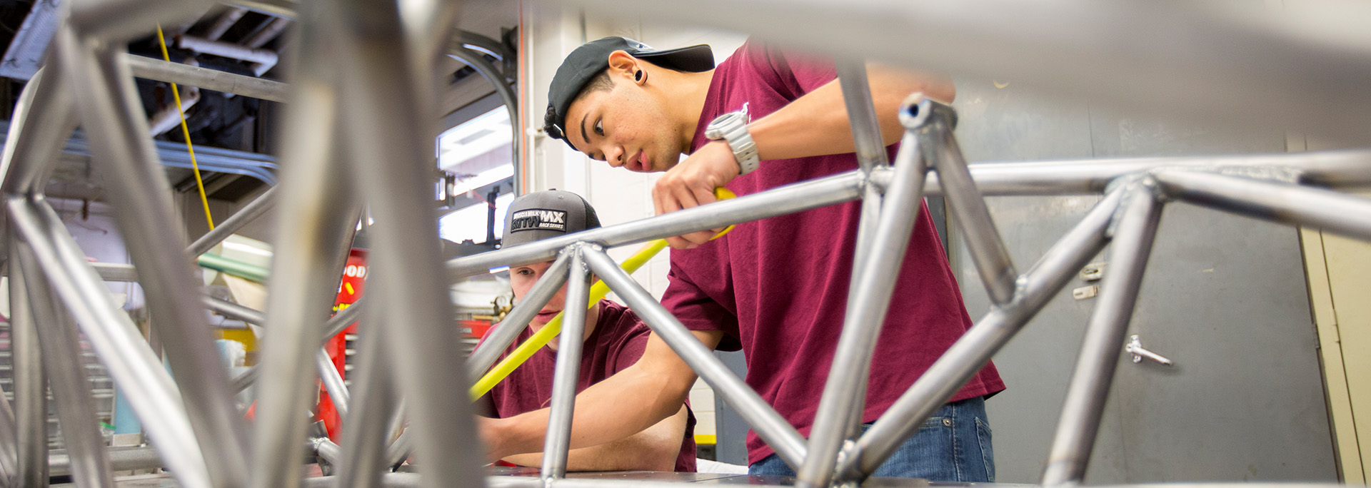 A student measuring a metal