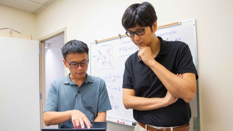 Yi “Max” Ren (left) and Yang Jiao (right) look at a laptop screen. Ren, an associate professor of aerospace and mechanical engineering, and Jiao, a professor of materials science and engineering, are both faculty members in the School for Engineering of Matter, Transport and Energy, part of the Ira A. Fulton Schools of Engineering at Arizona State University. The researchers have been granted $465,000 in funding by the National Science Foundation to use artificial intelligence to study the relationship between a material’s microstructure and its properties. Photographer: Erika Gronek/ASU